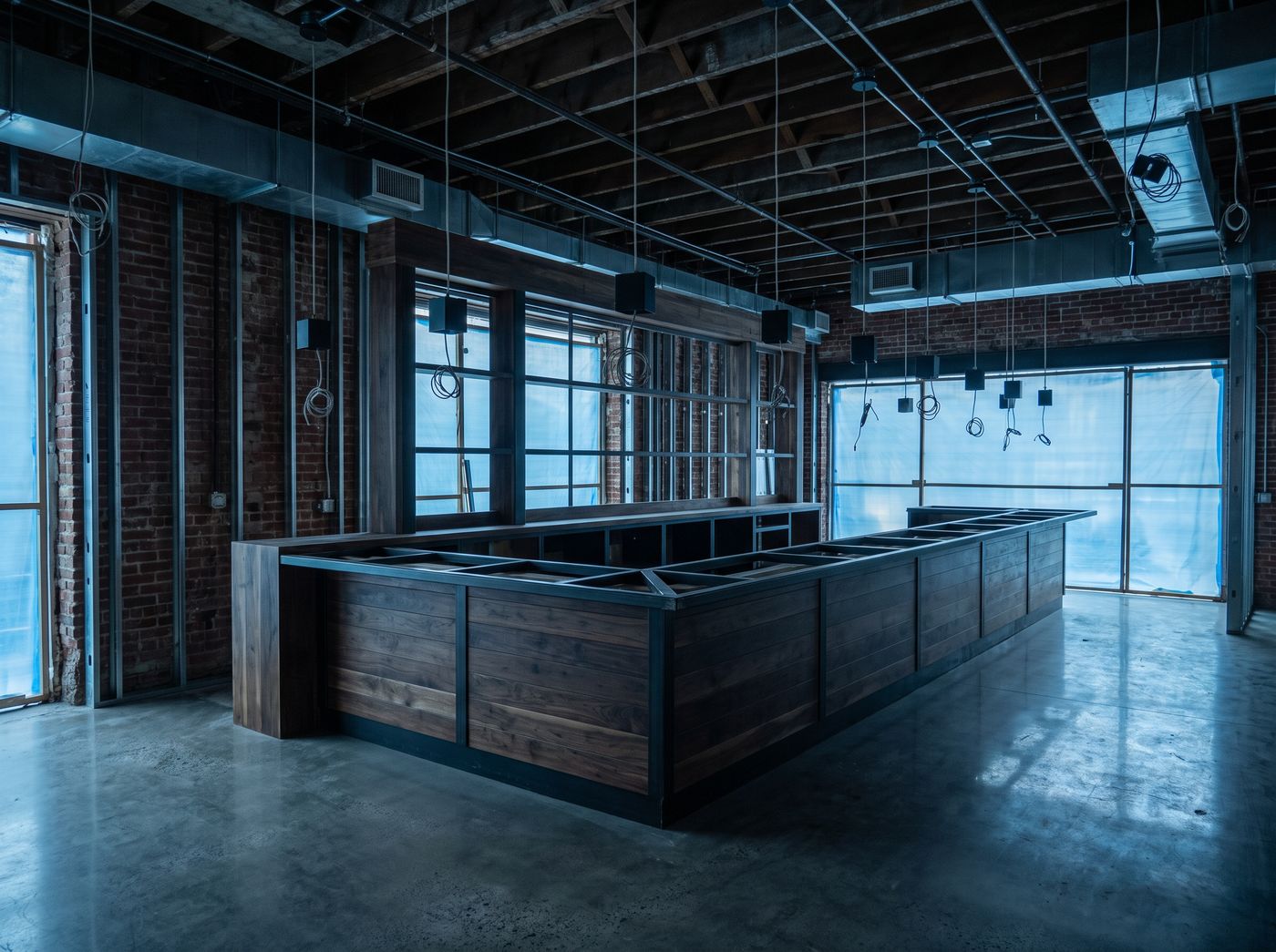 Restaurant interior build-out in progress, custom millwork bar frame